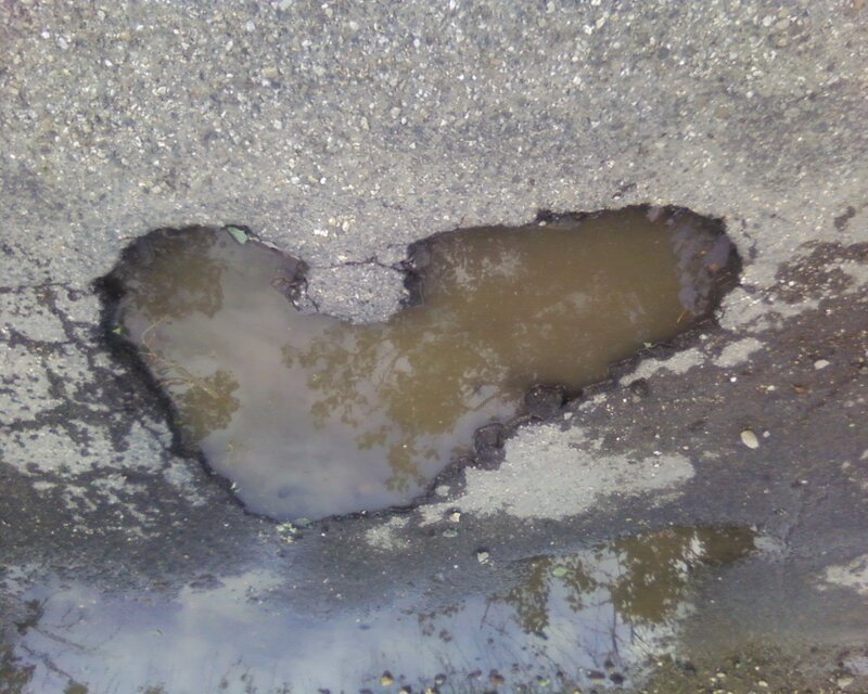 Pothole filled with water