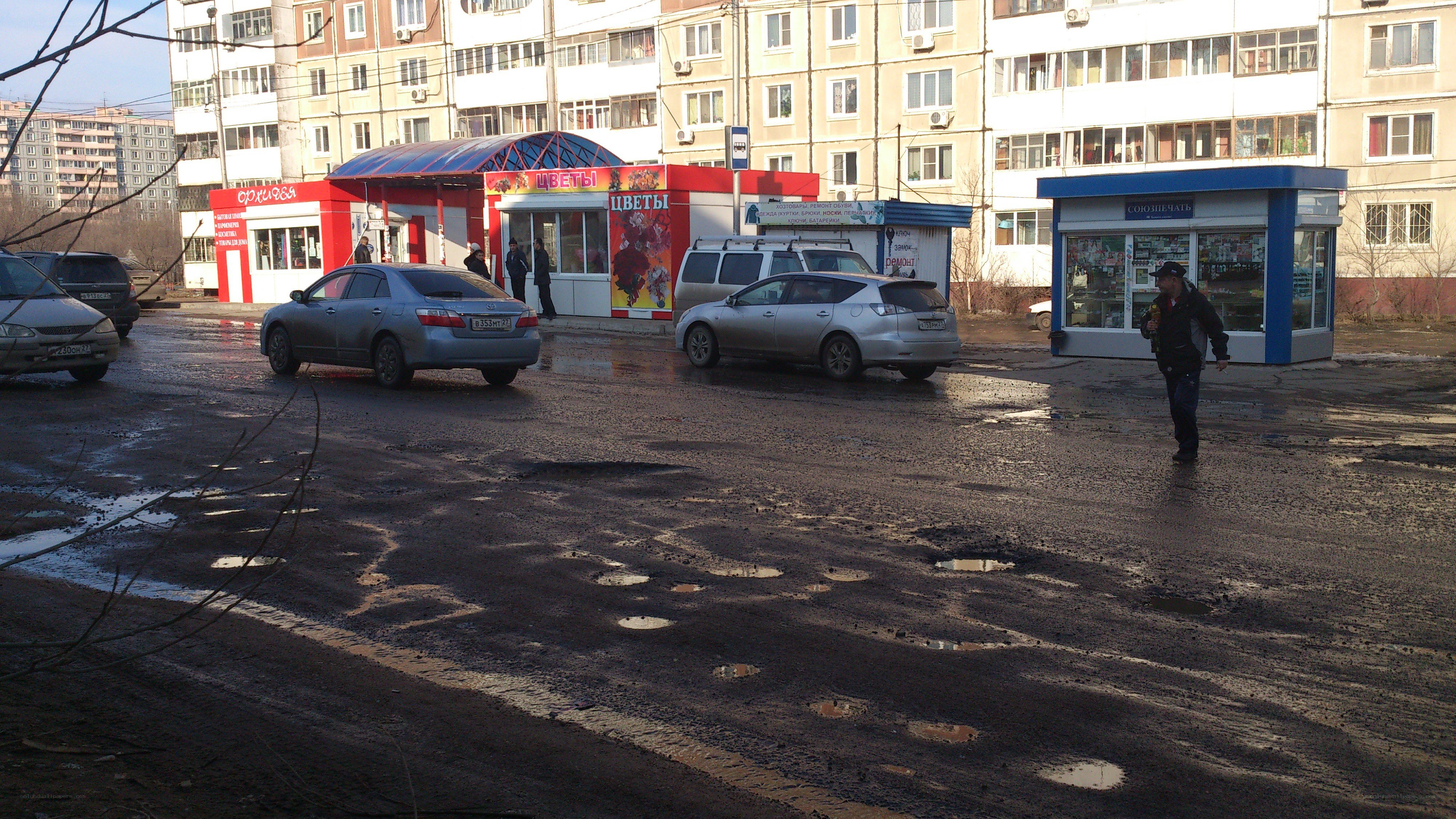 Pothole-ridden street in urban area
