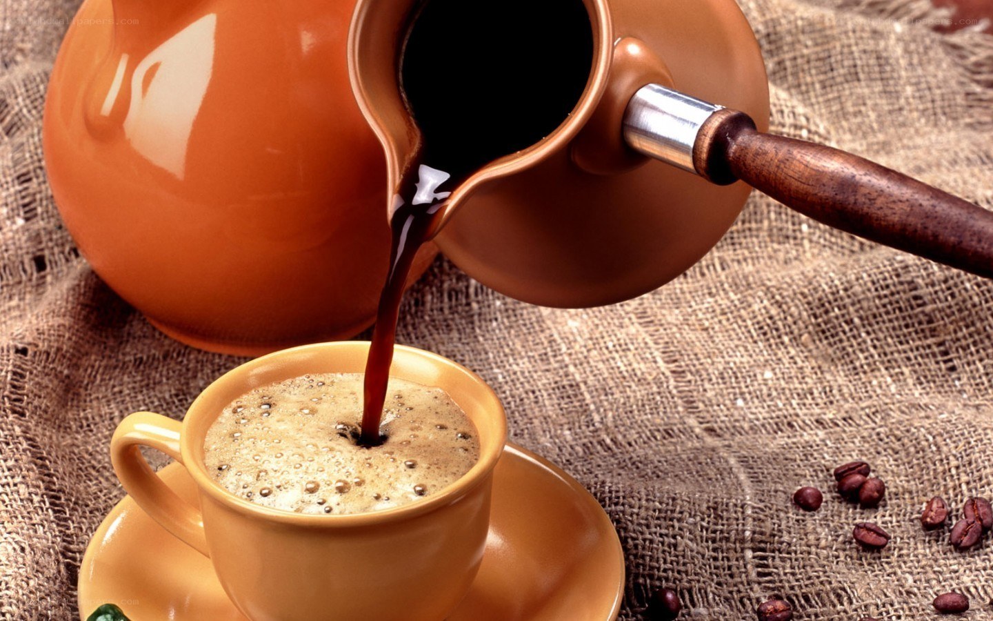 Pouring coffee into a cup