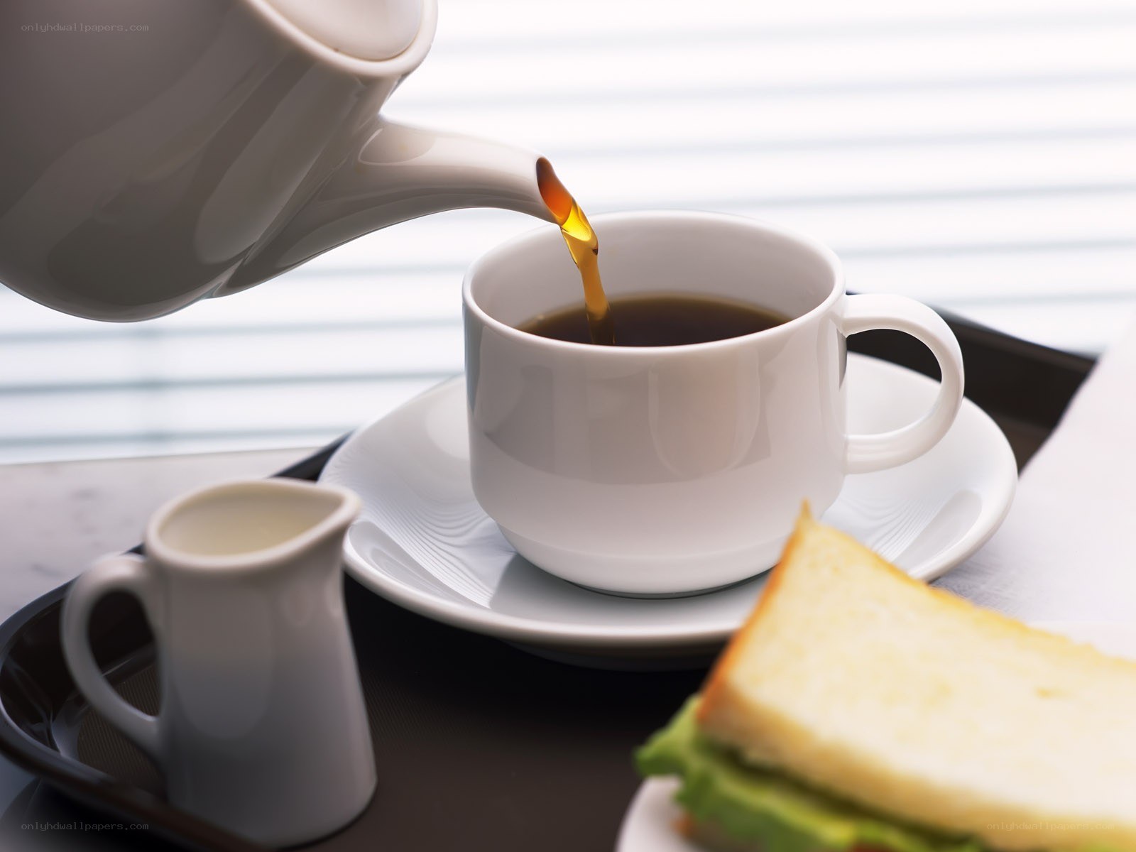 Pouring coffee into a cup