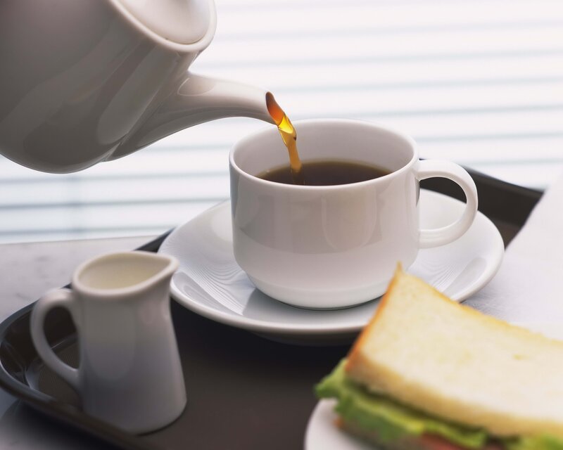 Pouring coffee into a cup