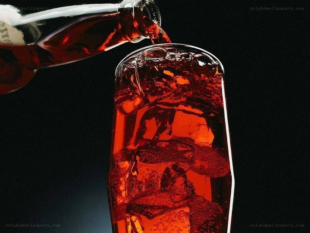 Pouring cola into a glass