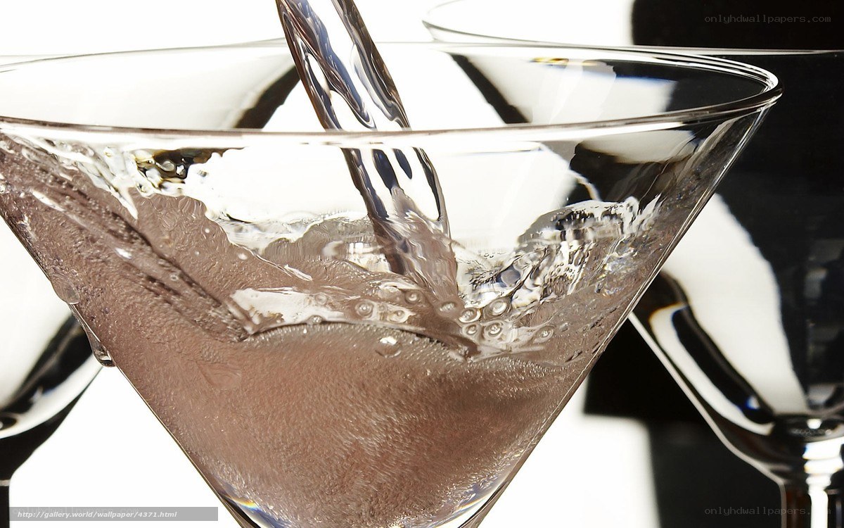 Pouring drink into martini glass