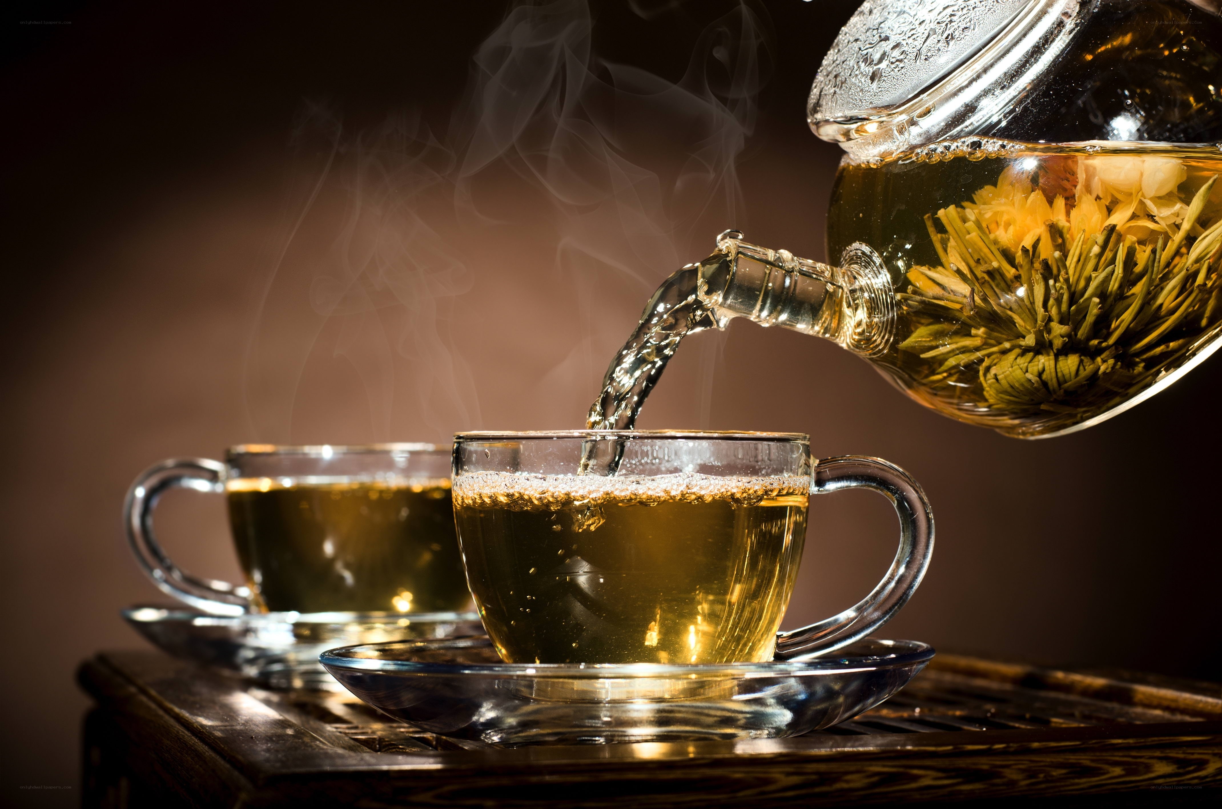 Pouring hot tea from a teapot