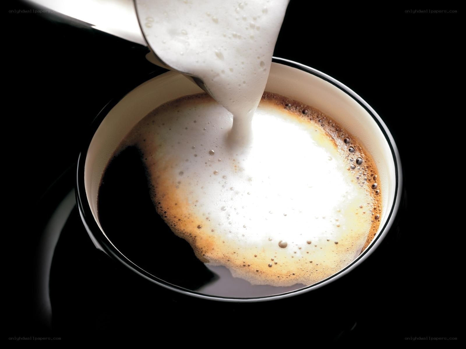 Pouring milk into coffee
