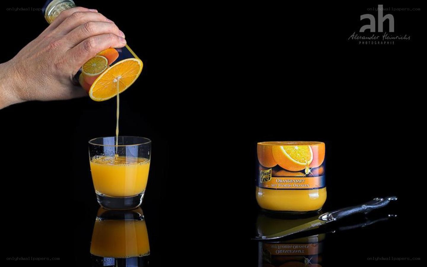 Pouring orange juice from a jar