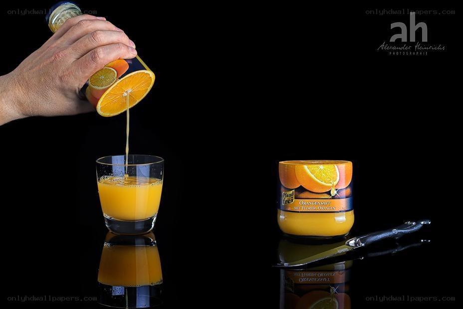 Pouring orange juice into a glass