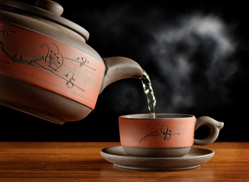 Pouring tea from a teapot