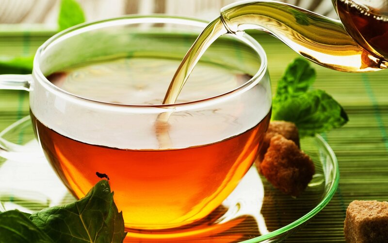 Pouring tea into a cup
