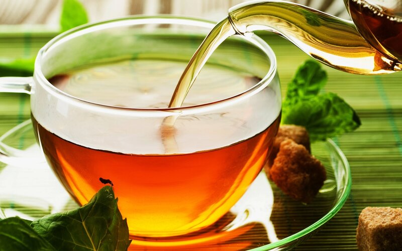Pouring tea into a cup