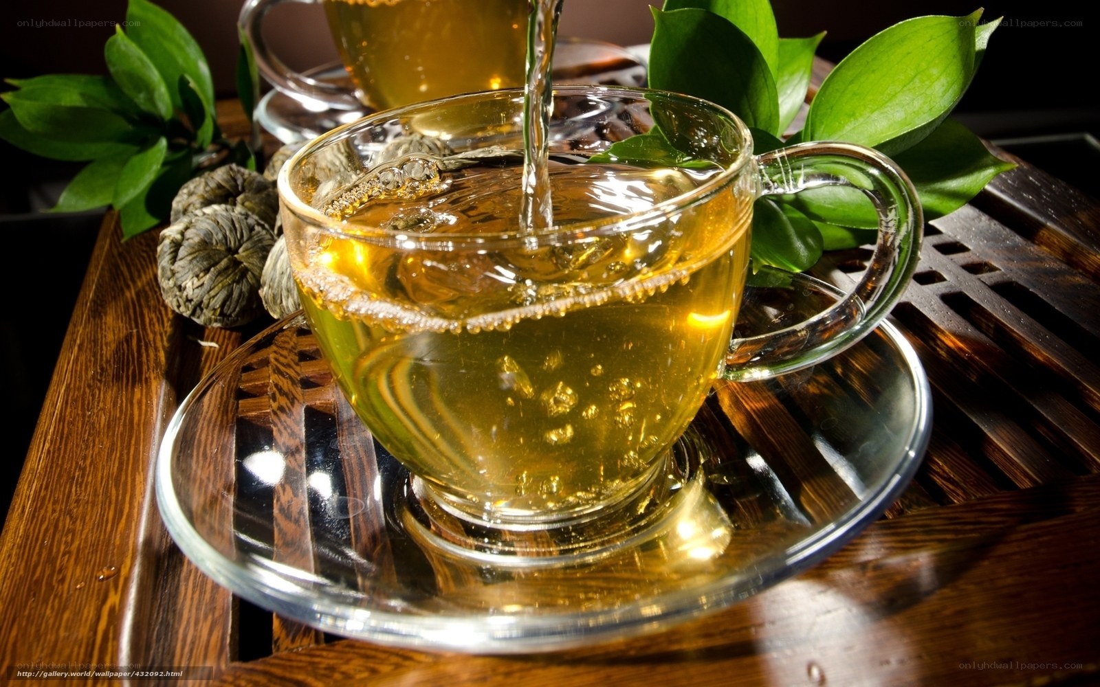 Pouring tea into a glass cup