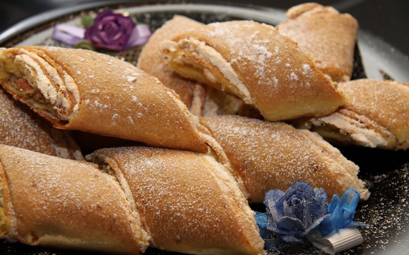 powdered pastries on a platter