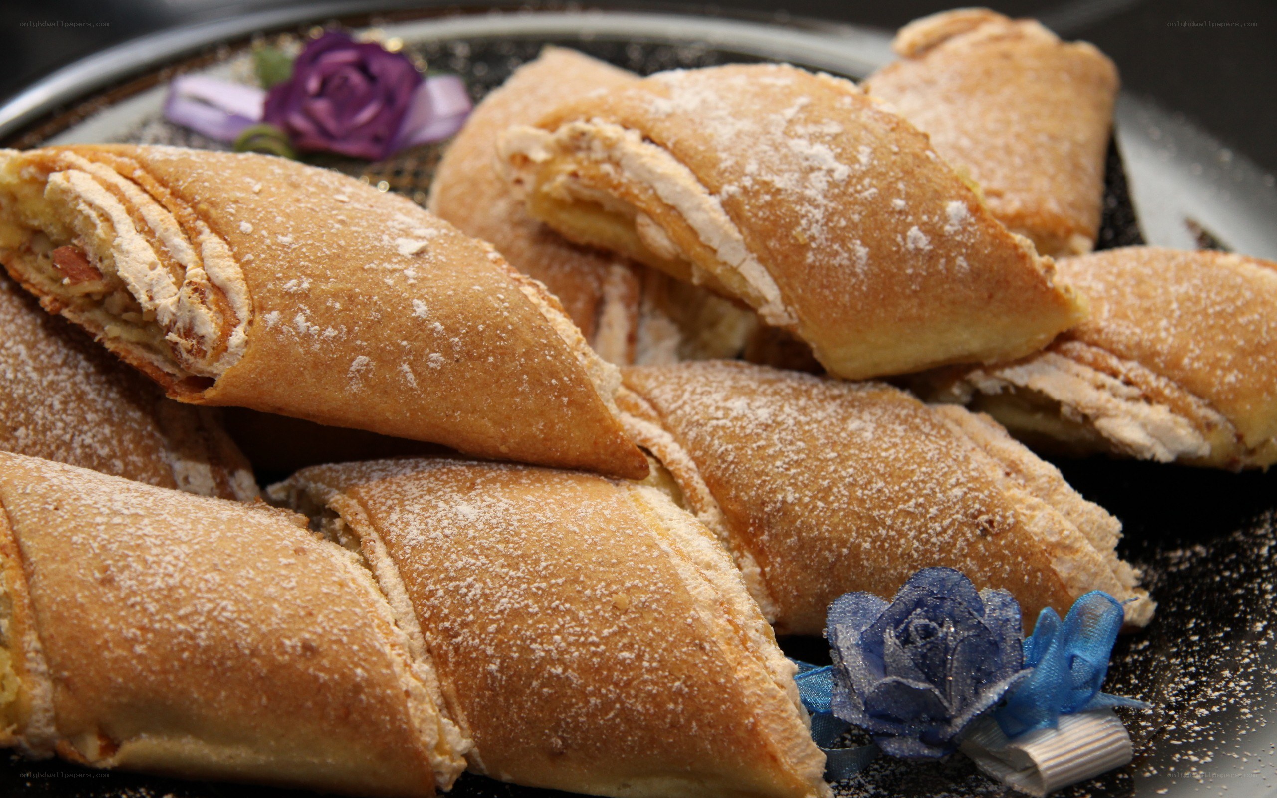powdered pastries on a platter