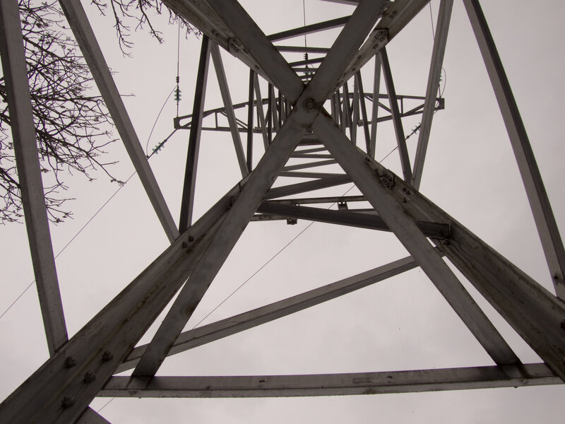 Power line tower from below