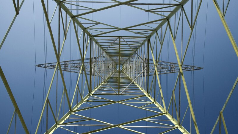 Power line tower from below