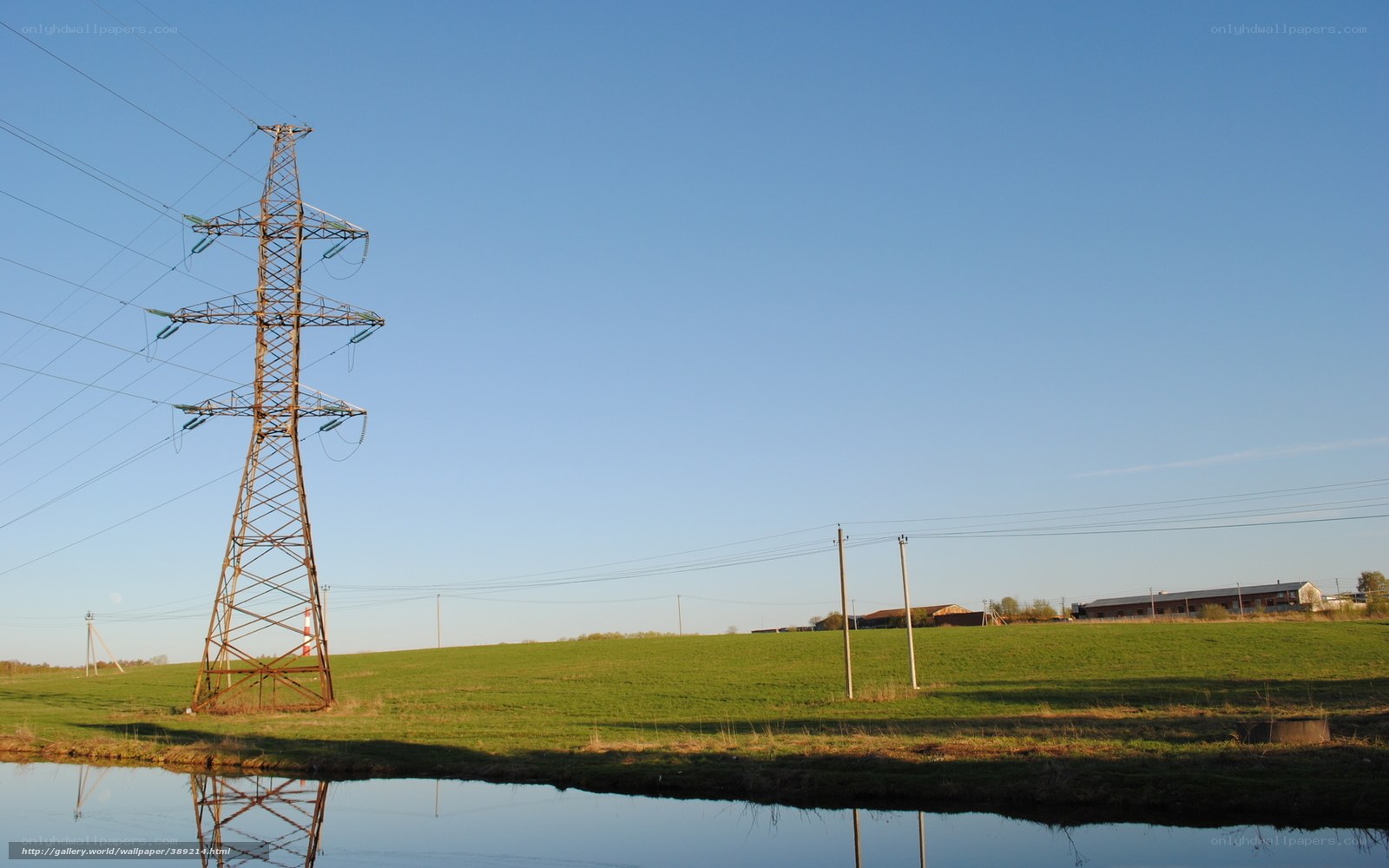 Power line tower in a field