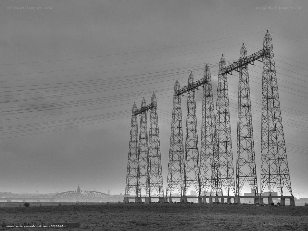 Power line towers in a field