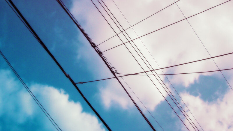 Power lines against a blue sky