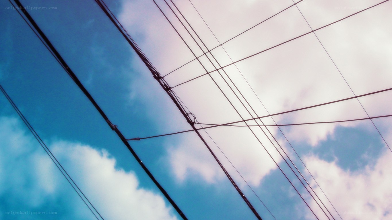 Power lines against a blue sky