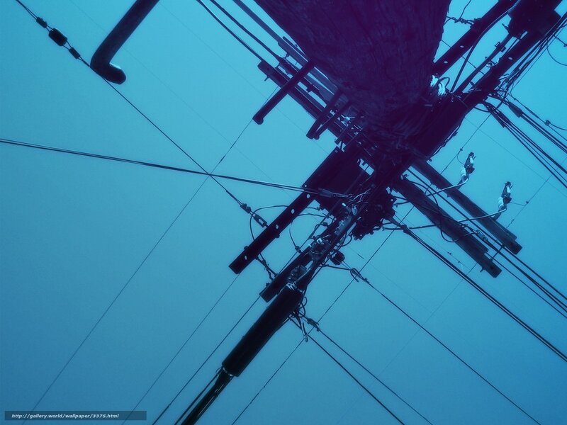 Power lines against blue sky