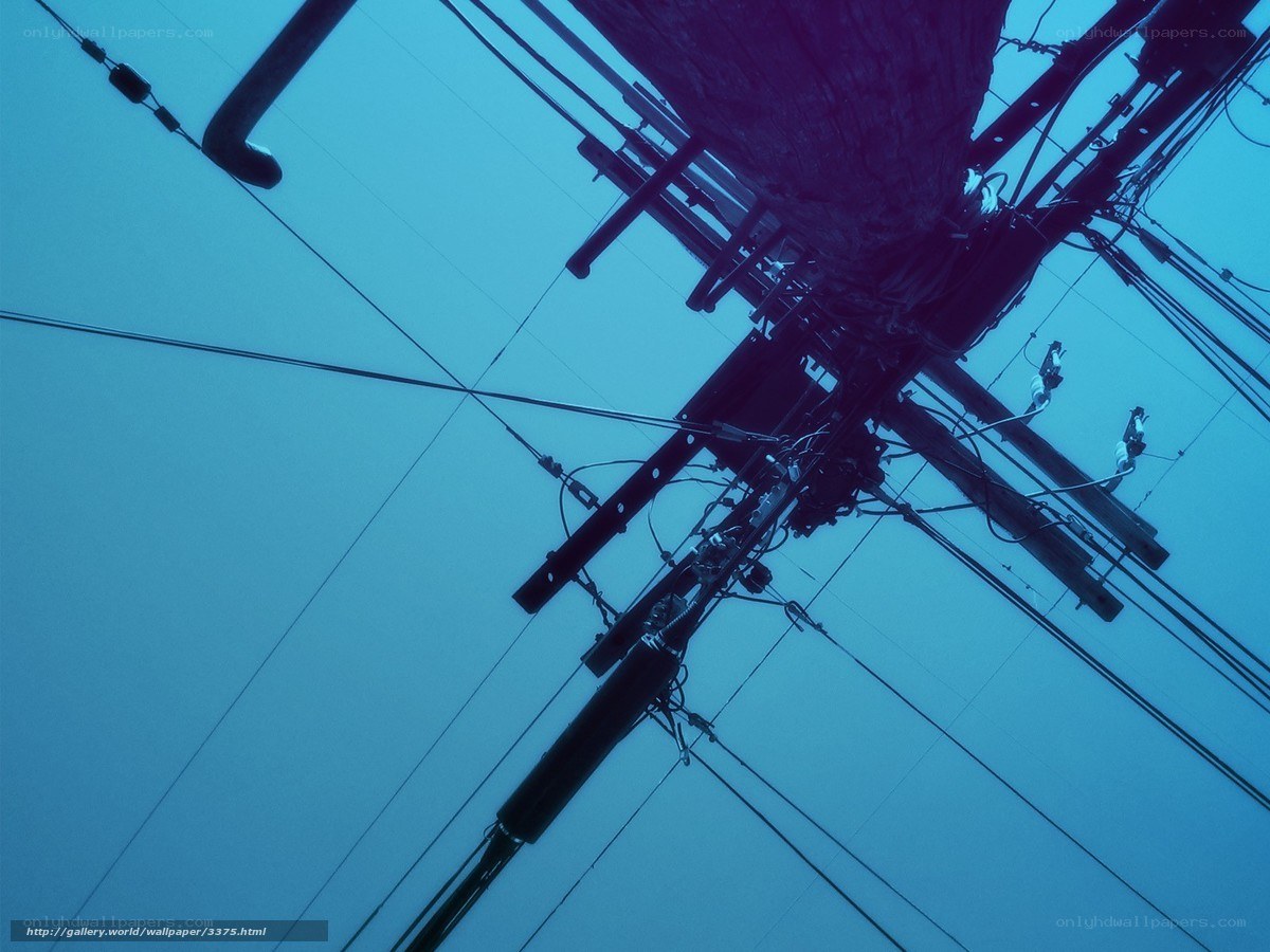 Power lines against blue sky