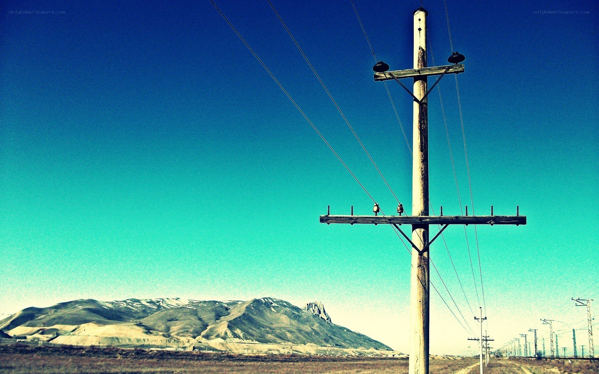 Power lines in a desert landscape