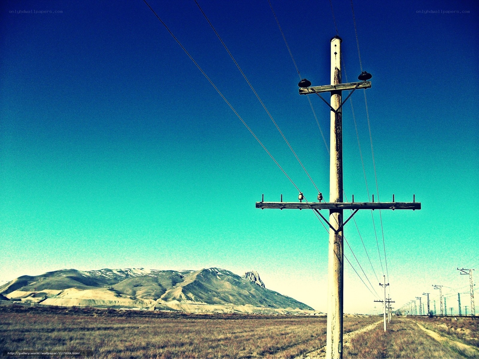 Power lines in a desert landscape