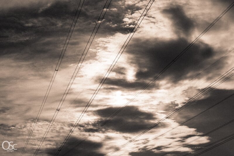 Power Lines in Cloudy Sky