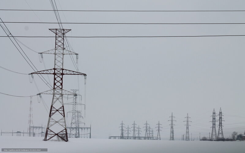 Power lines in snowy landscape