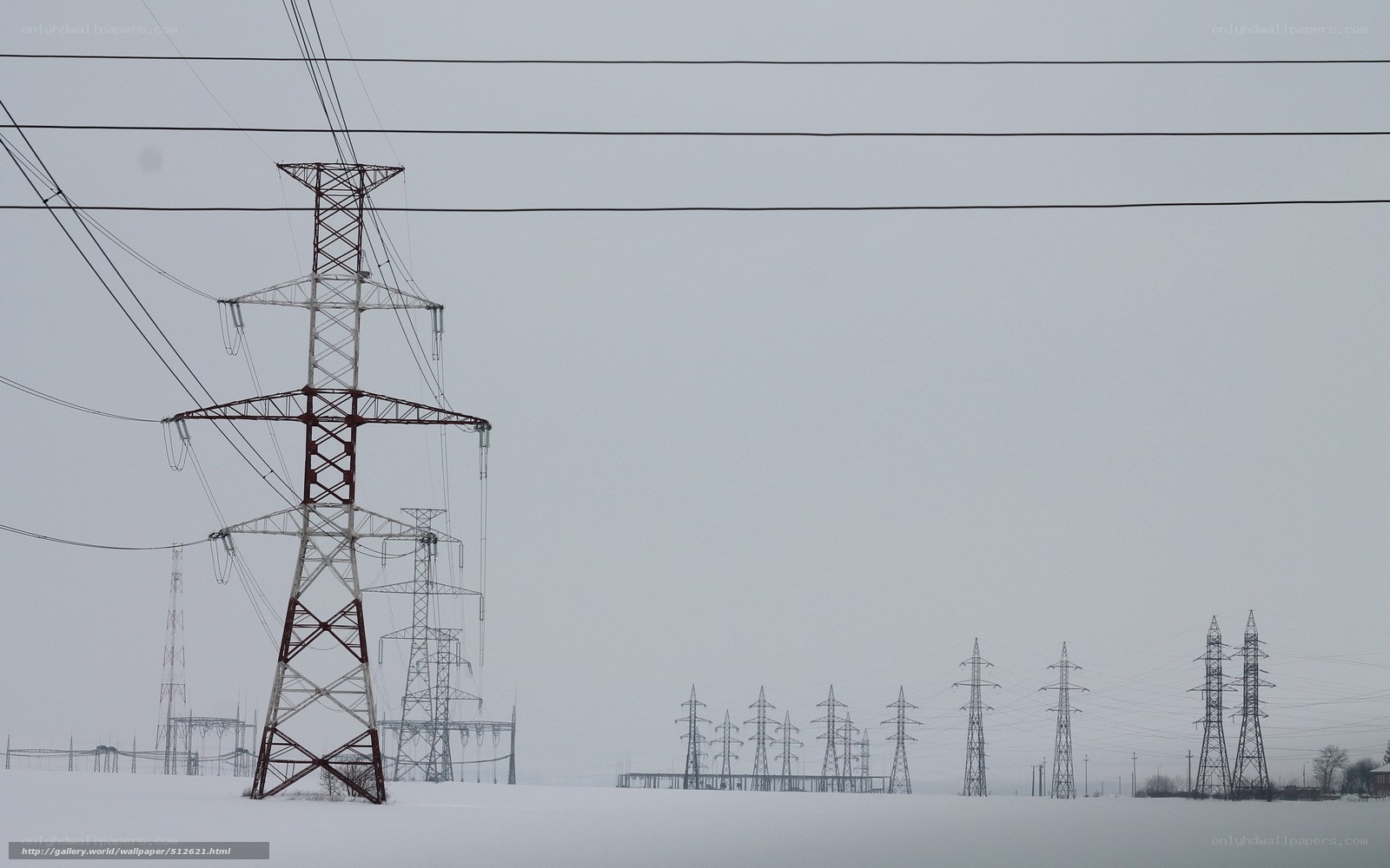 Power lines in snowy landscape