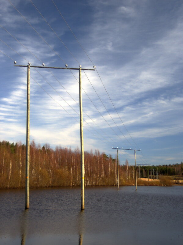 Power lines over flooded land