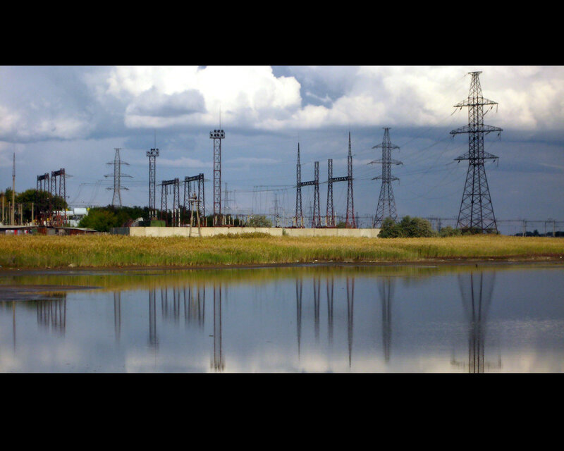 Power lines reflected in water