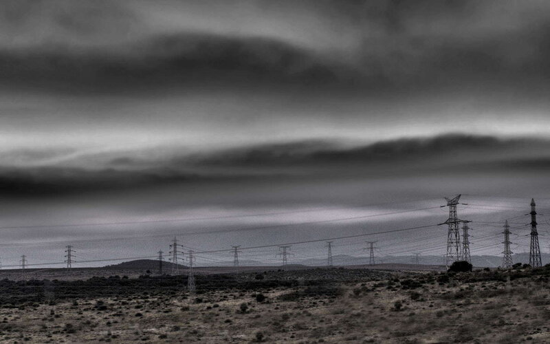 Power lines under stormy sky