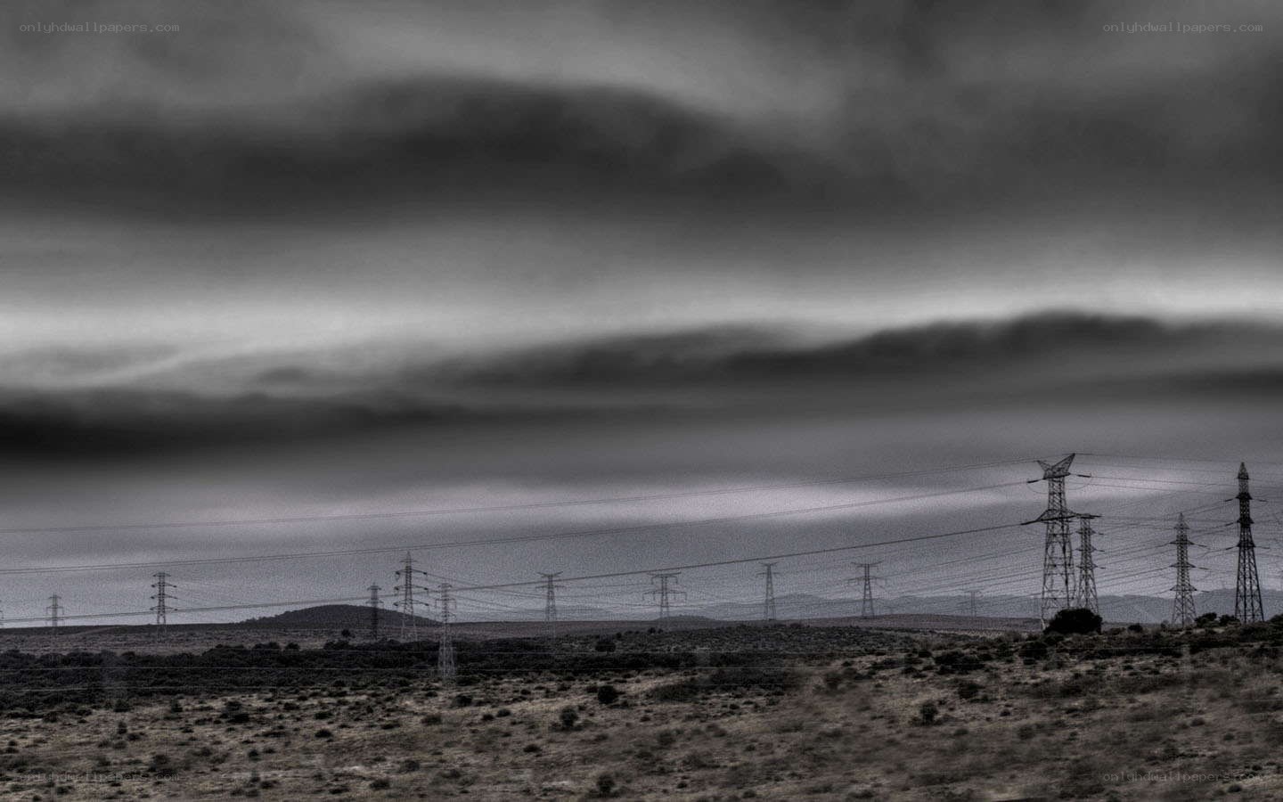 Power lines under stormy sky