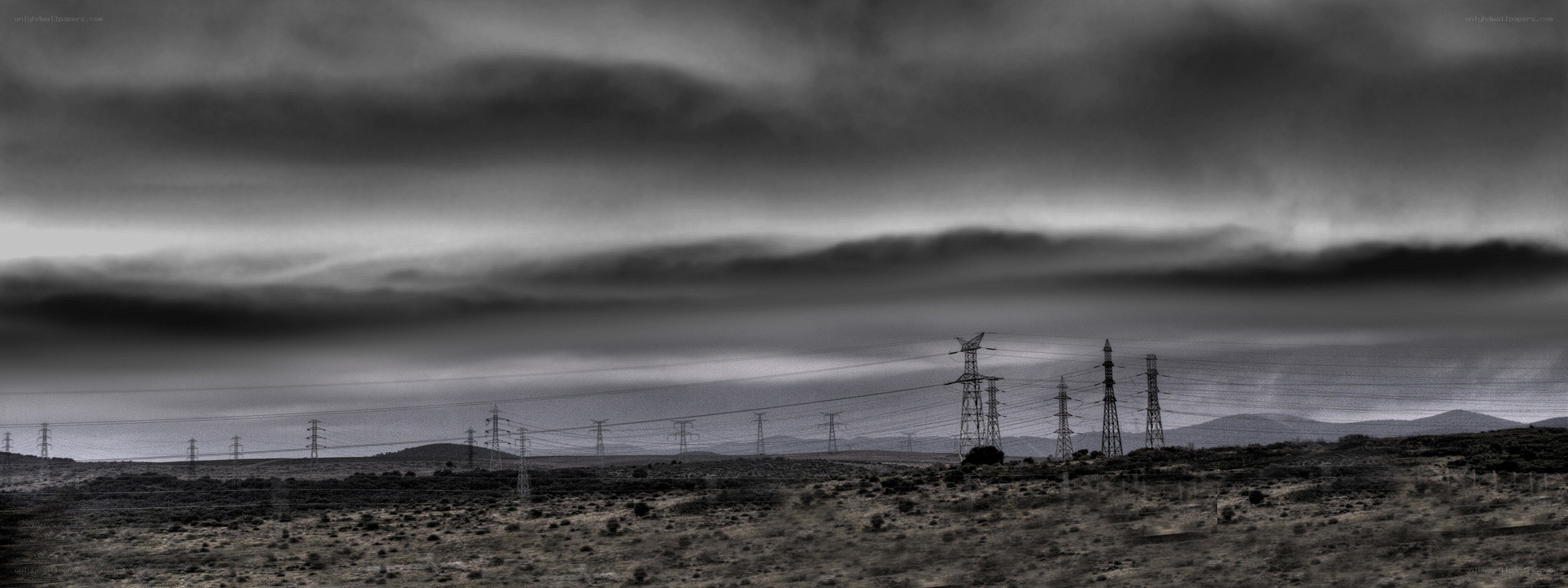 Power lines under stormy sky