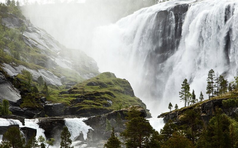 powerful waterfall in a forest
