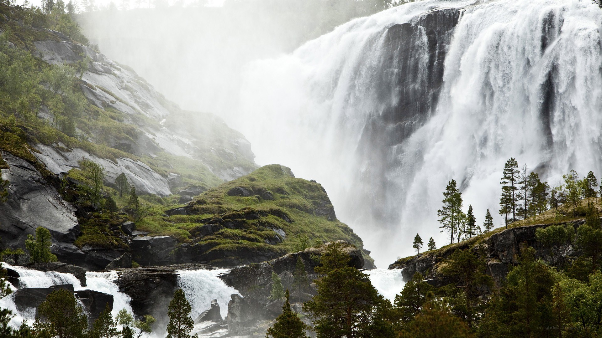 powerful waterfall in a mountain valley