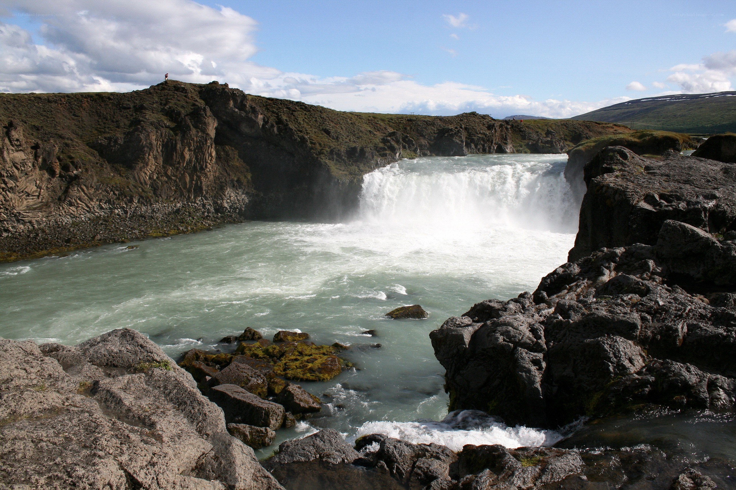 powerful waterfall in rocky canyon
