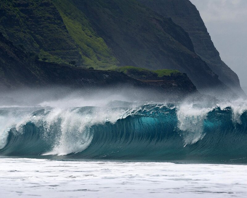 Powerful wave crashing against cliffs