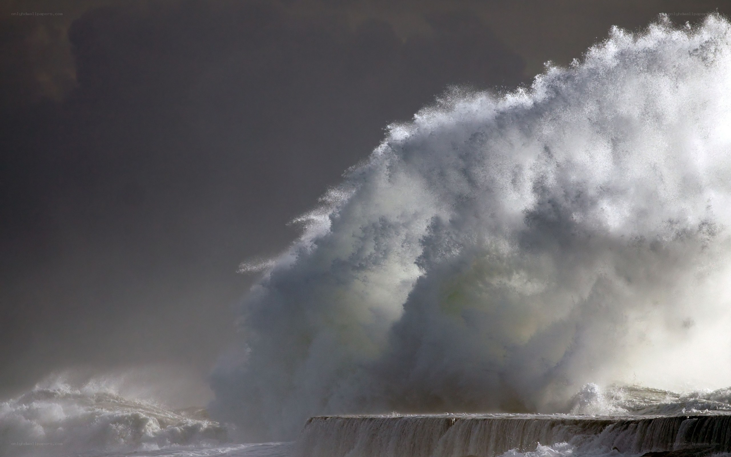 Powerful wave crashing on pier