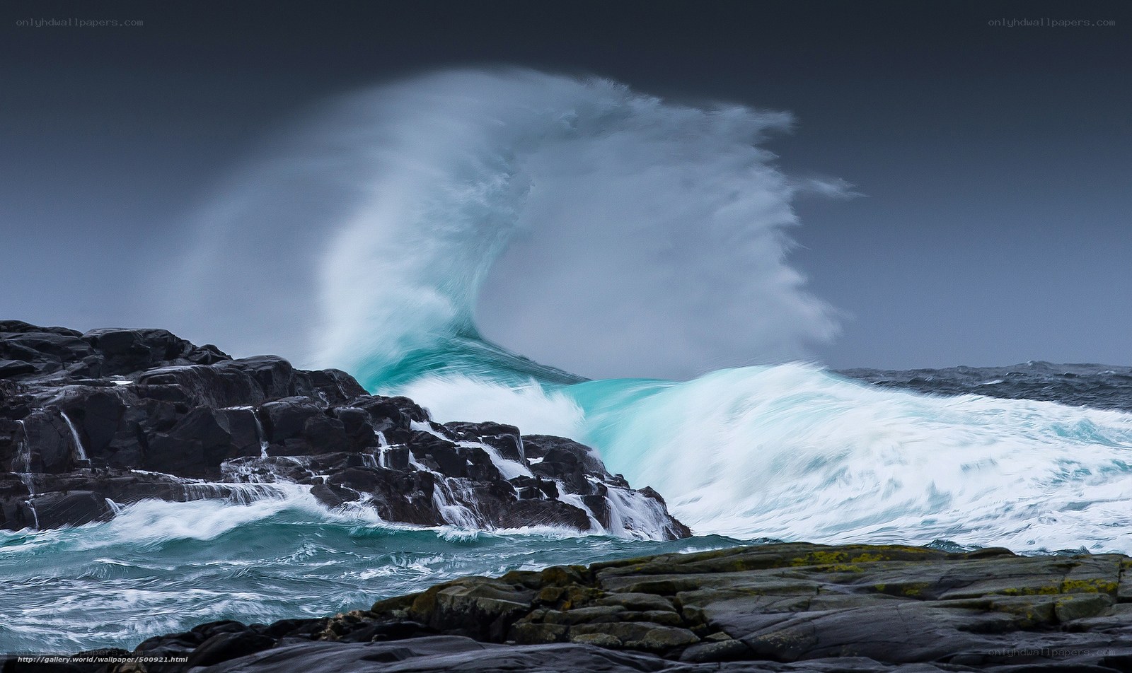 Powerful wave crashing on rocks