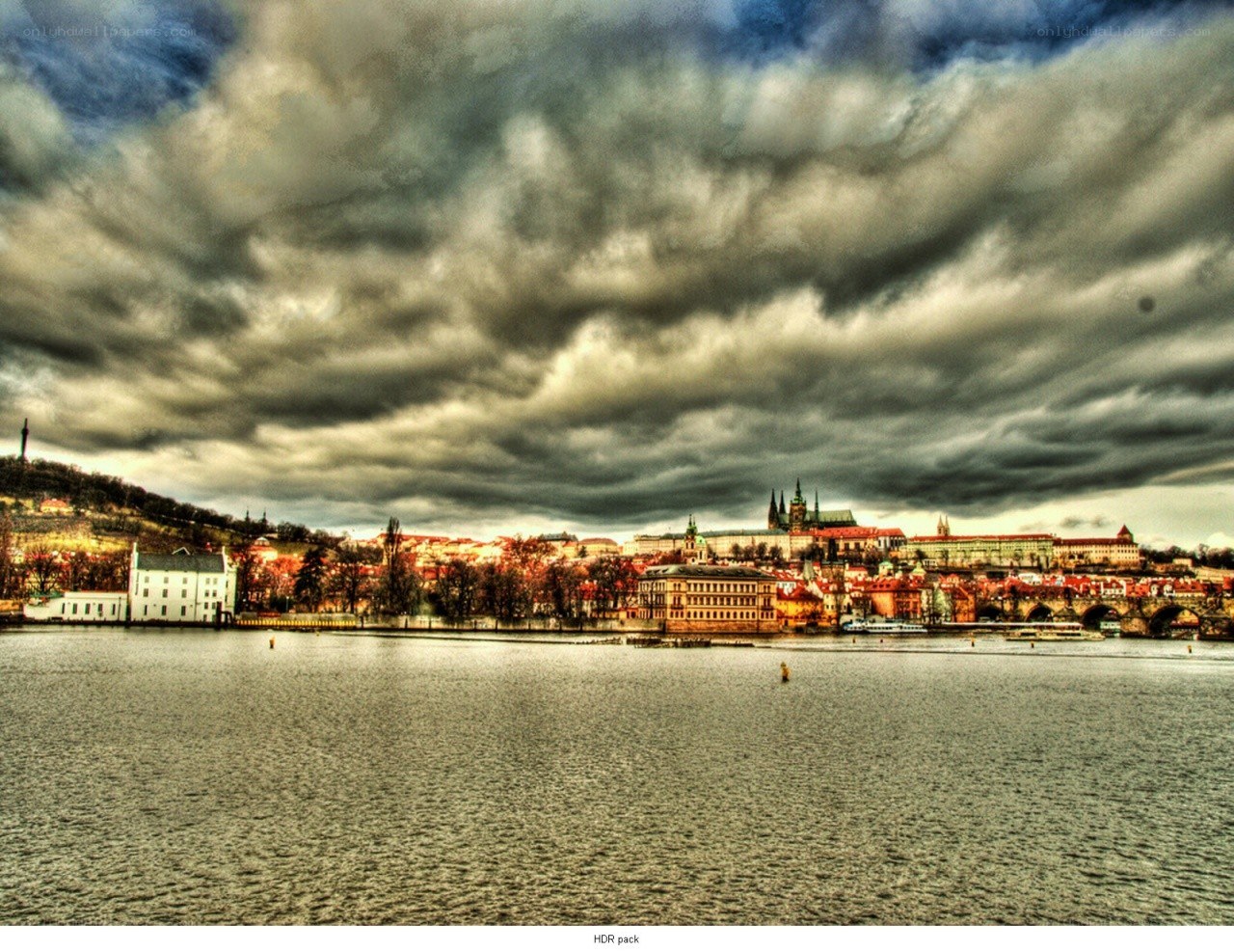 Prague skyline under stormy sky