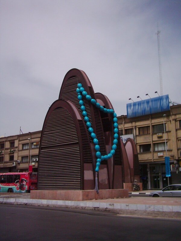 prayer beads sculpture in city
