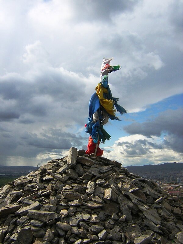 Prayer flags on a stone cairn