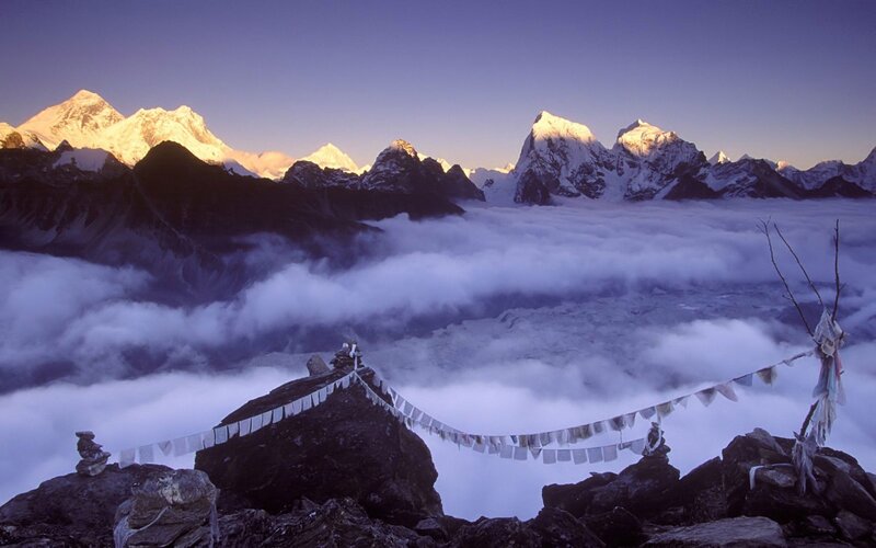 Prayer flags over mountain peaks
