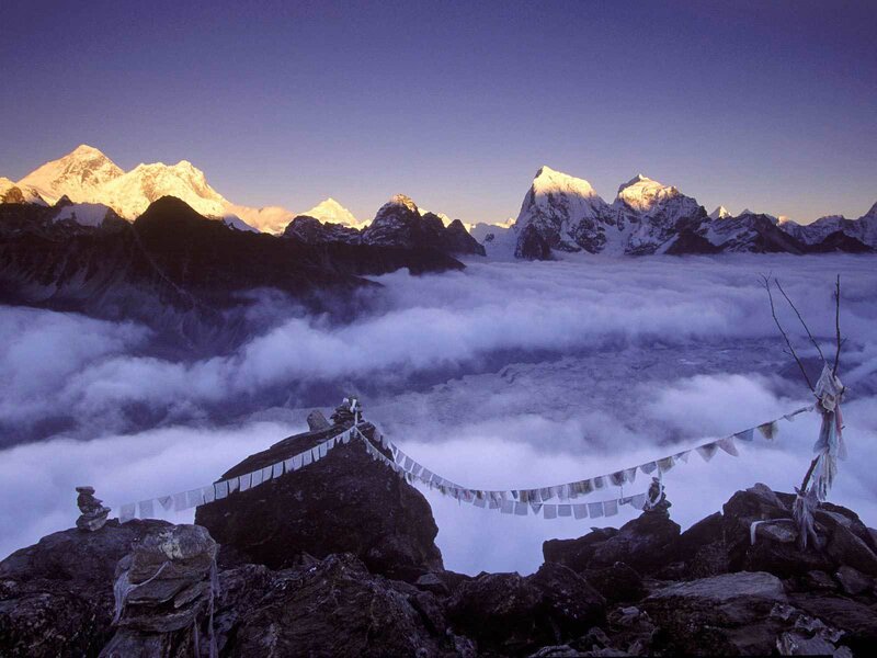 Prayer flags over mountain peaks