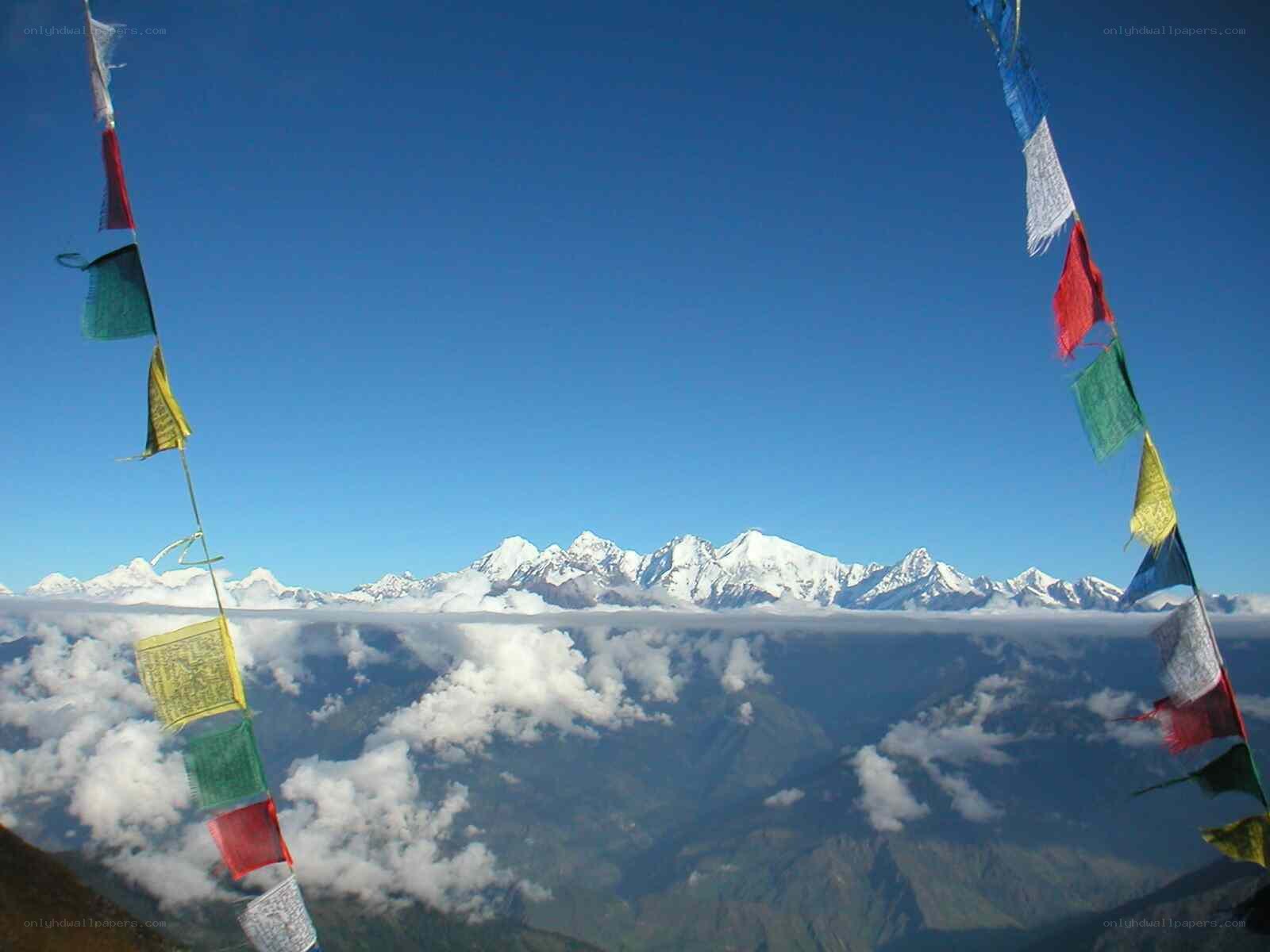 Prayer flags over snowy mountains