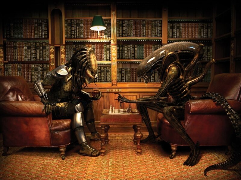 Predator and Alien playing chess