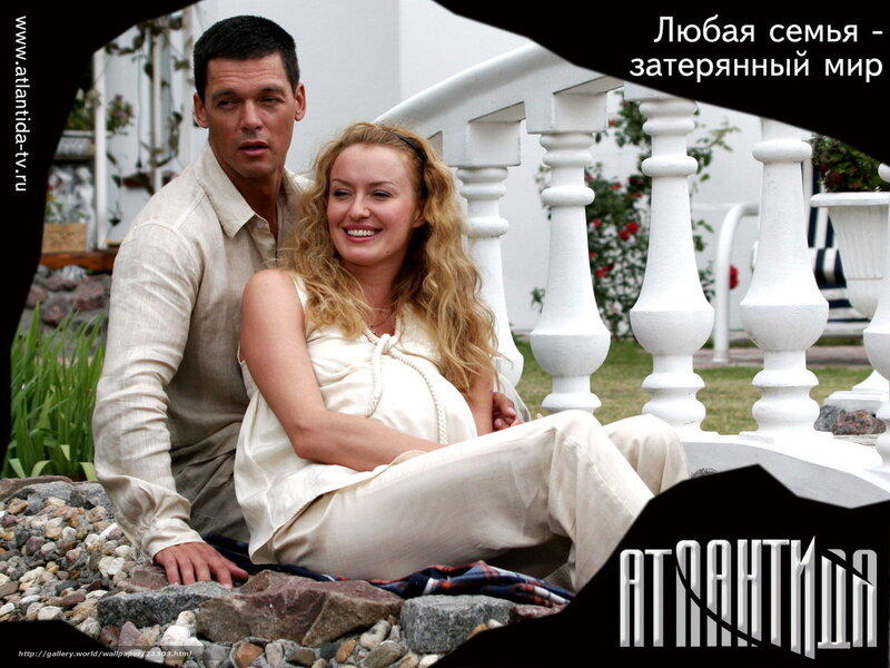 Pregnant couple on balcony