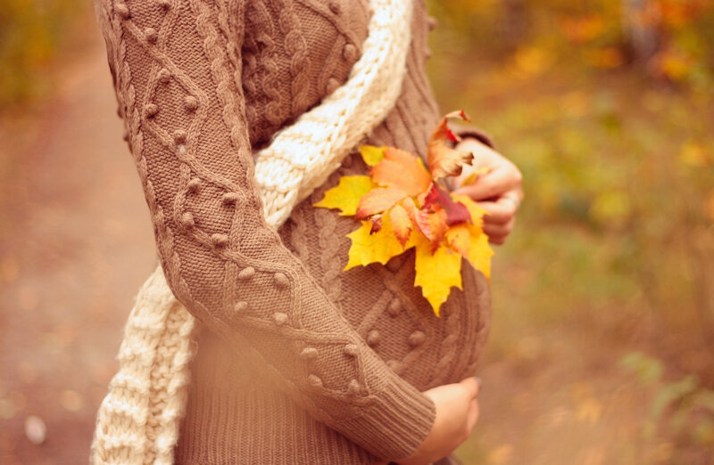 Pregnant Woman Holding Leaves